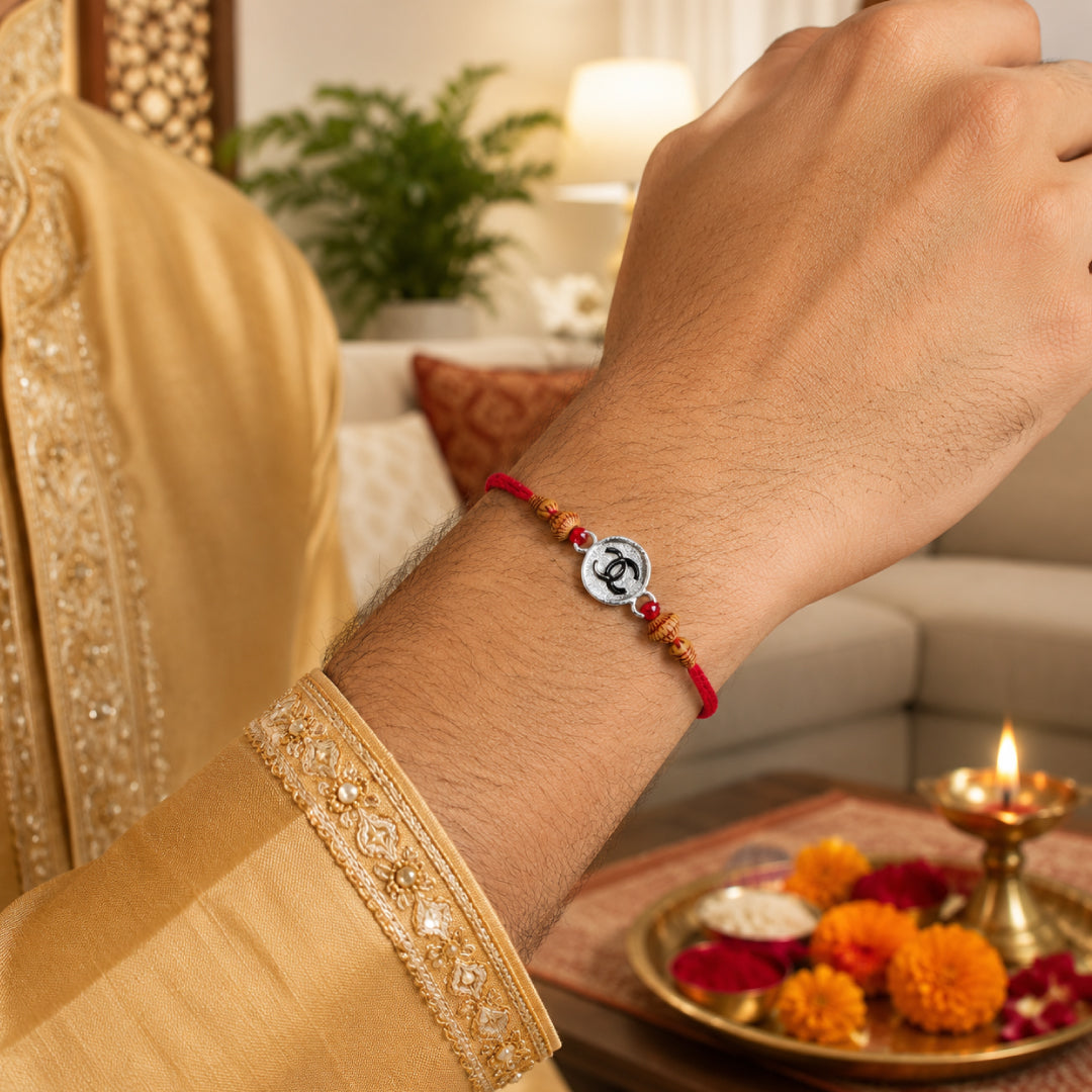 Twinklitz 925 Sterling Silver Interlocking C Rakhi - close-up view