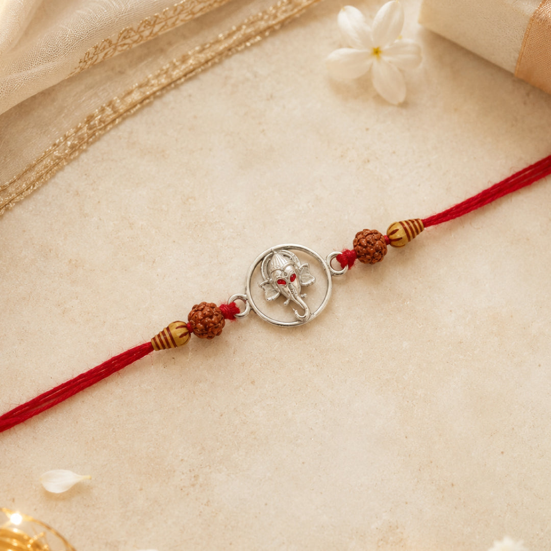 Twinklitz Sterling Silver Red Eyed Ganesha Rakhi - front view
