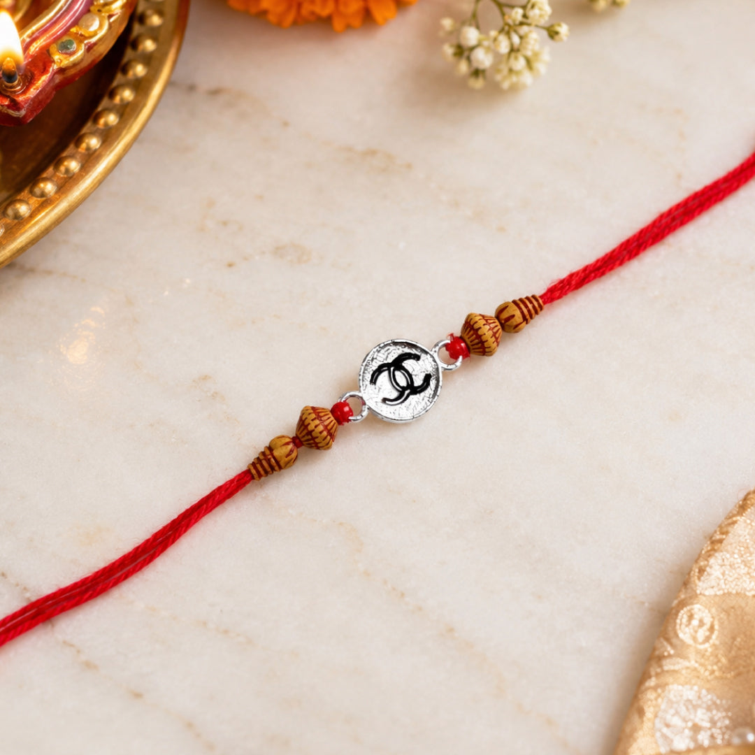 Twinklitz 925 Sterling Silver Interlocking C Rakhi - front view